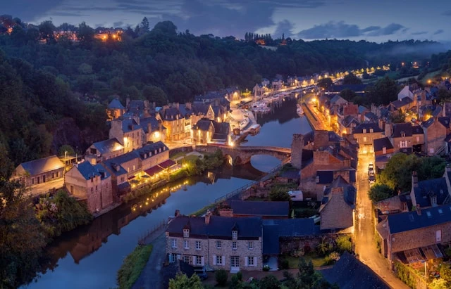 French Riverside Town at Dusk